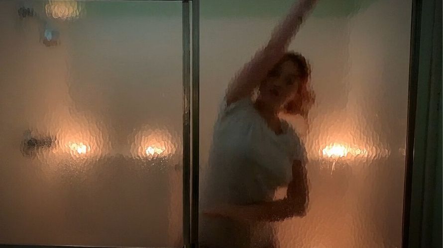 dancer Sam through translucent glass