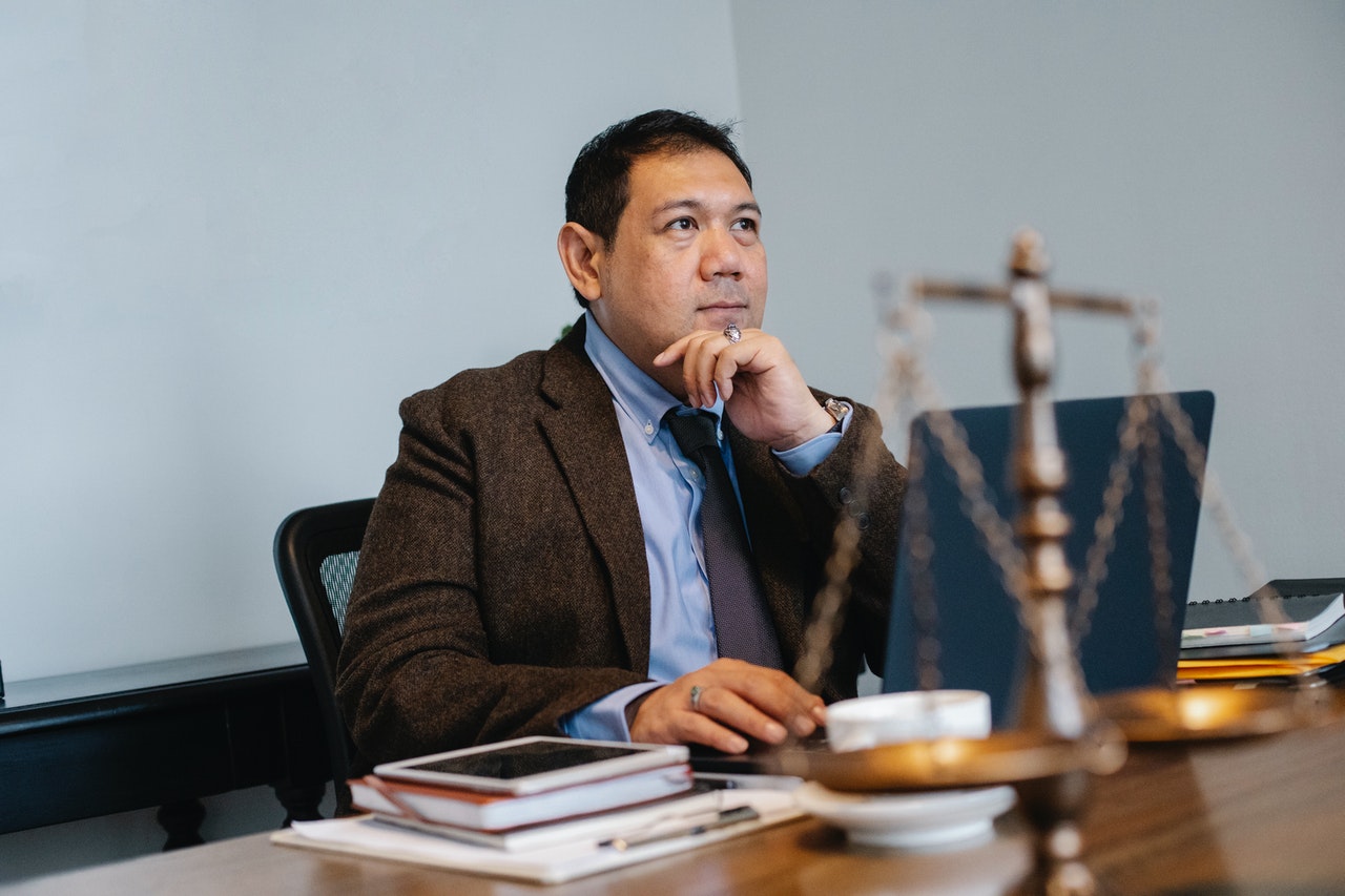 law professional working on a laptop in an office