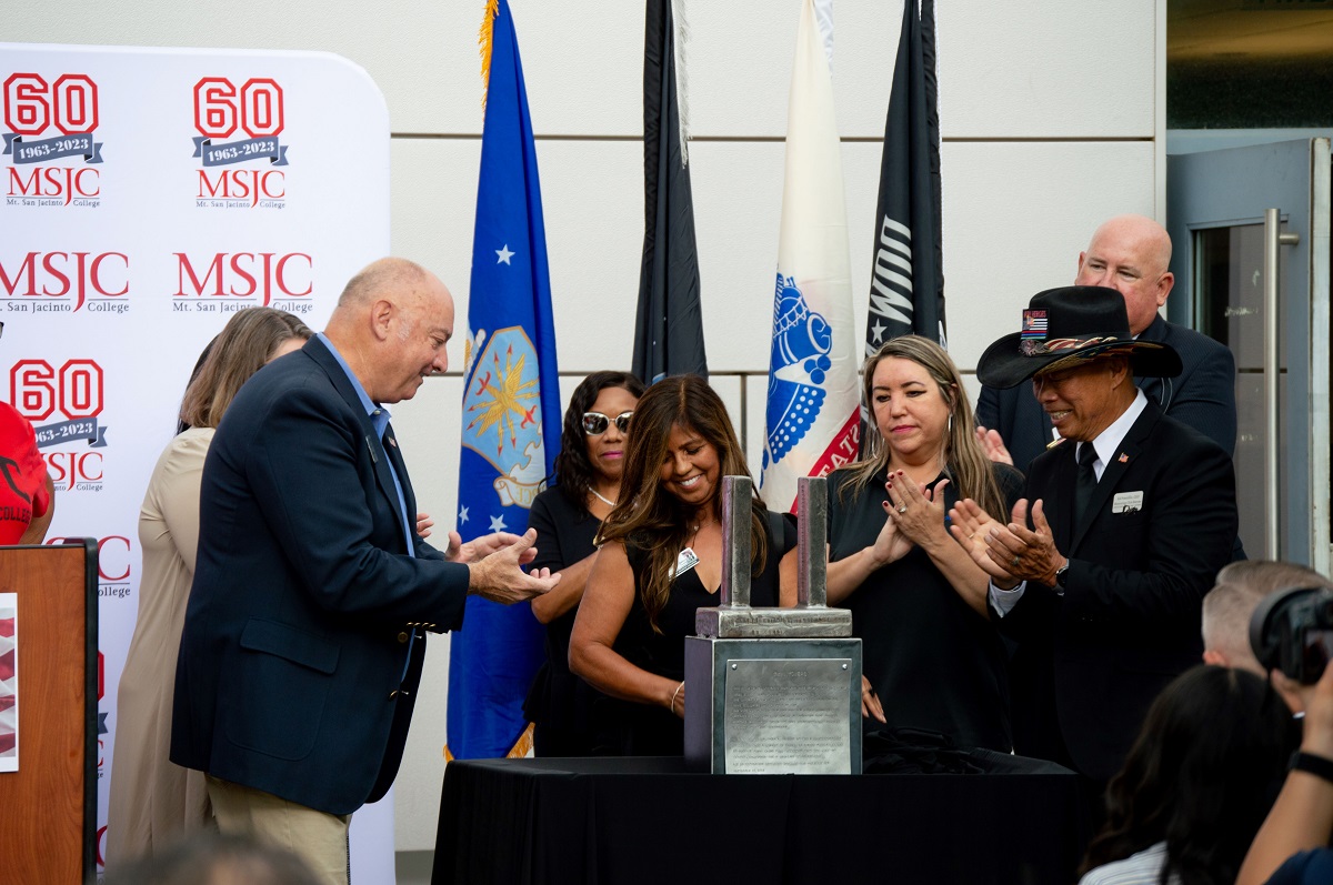 City of Menifee Mayor Bill Zimmerman and members of the event committee unveil a 9/11 artifact