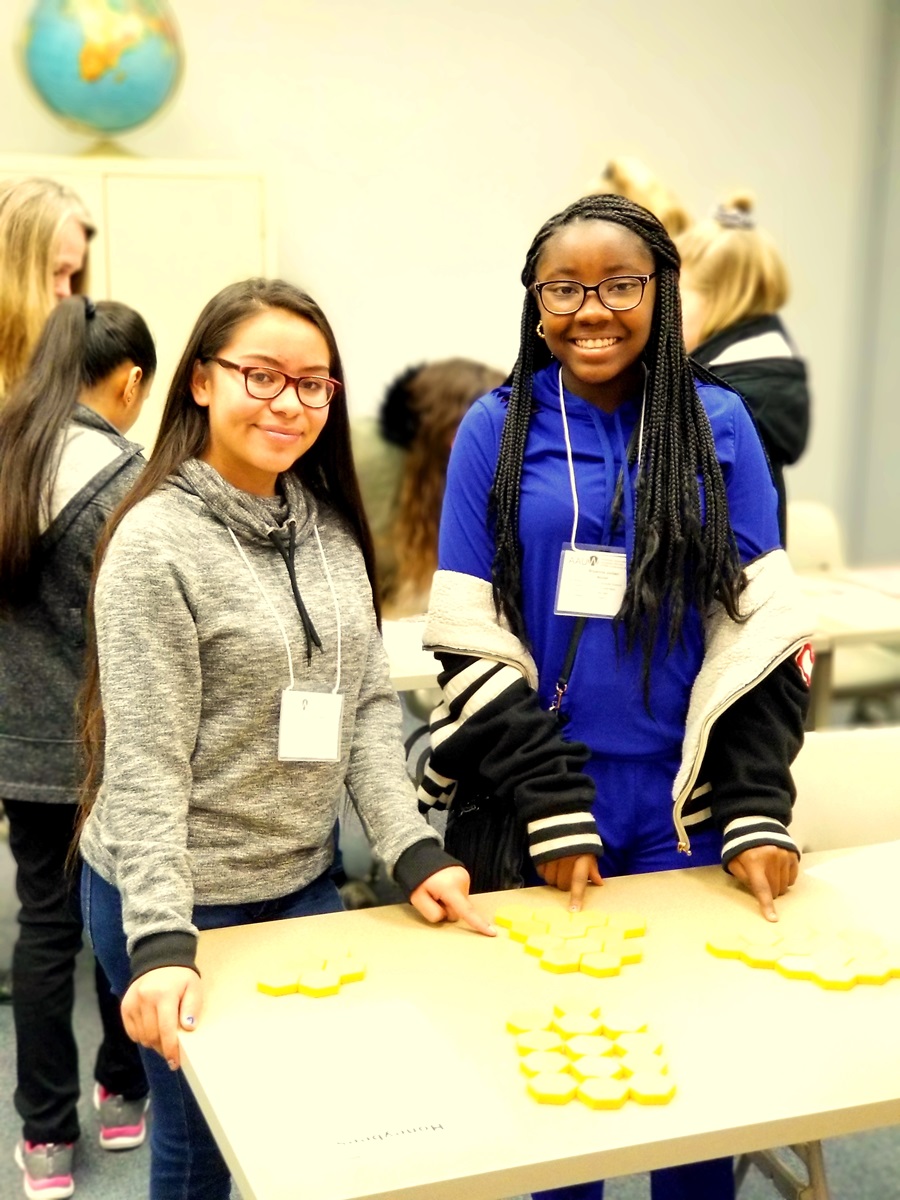 Xochiltlin Leal-Huerta and Bryannia Jordan work on the geometry of bee hives