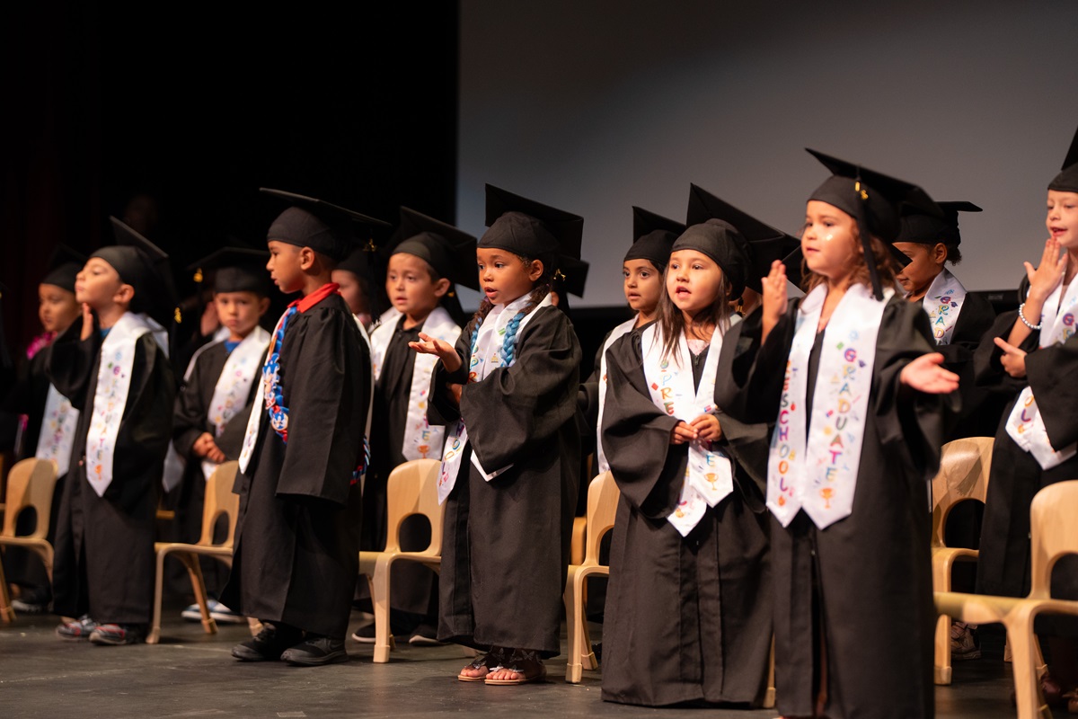 graduates on stage