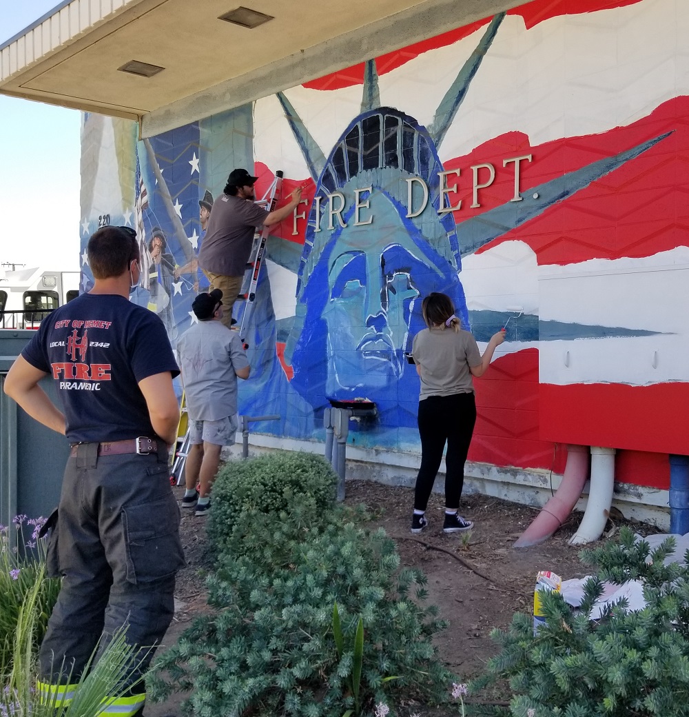 MSJC art students Vanessa Pellegrin and Mario Herrera used their talents to touch up a 9/11 mural at Hemet Fire Station No. 1