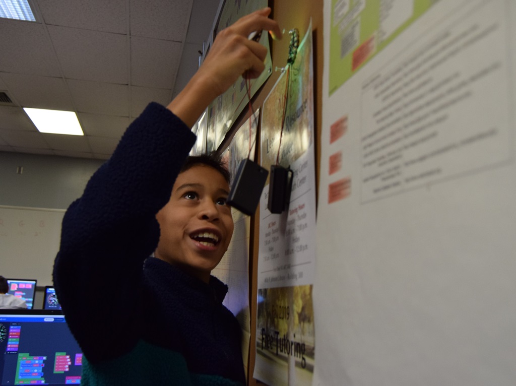 student at the board