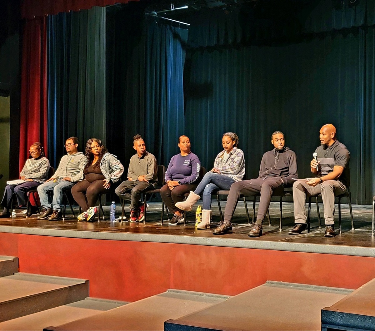 student panelists on stage in the San Jacinto Campus Theater