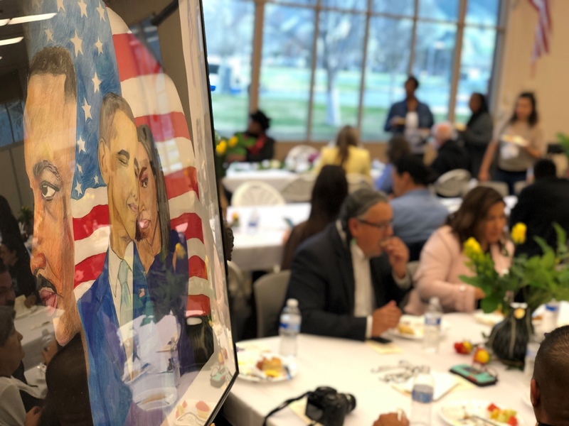 attendees enjoy art and breakfast