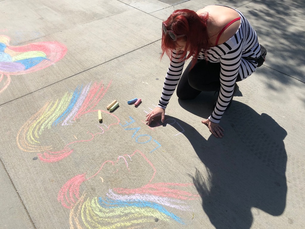students draw chalk art to support USAW