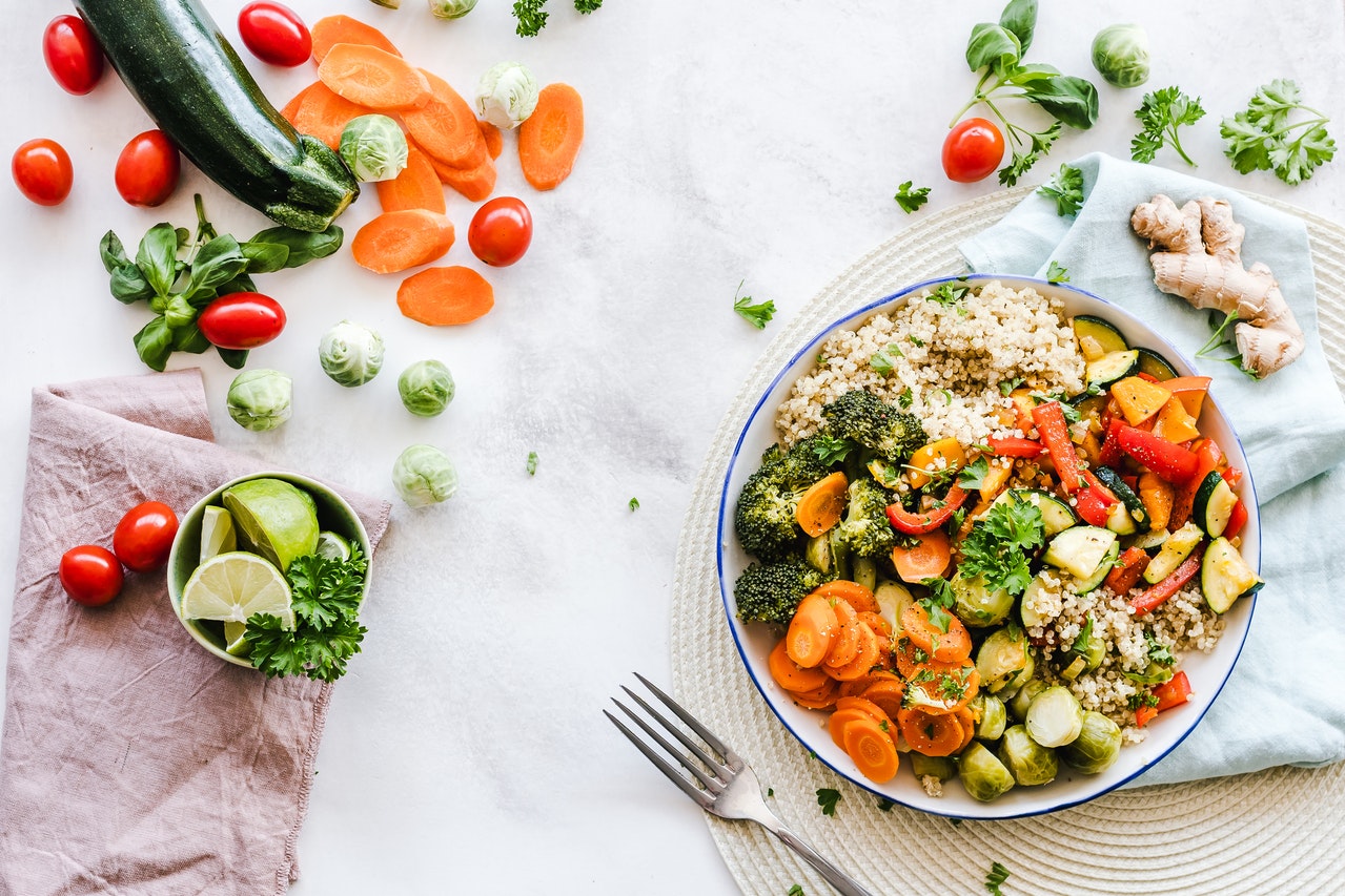 table with vegetables and a plate of food