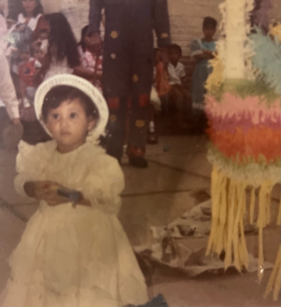 Adriana Uribe in a white dress