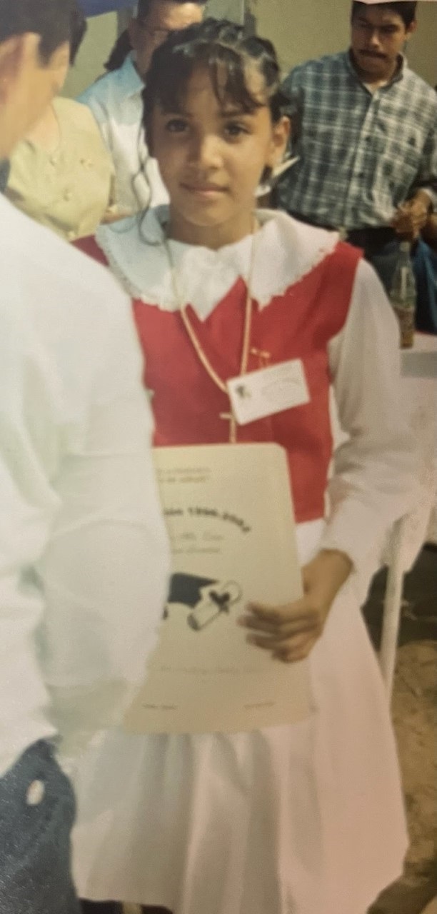 Adriana Uribe holding a certificate